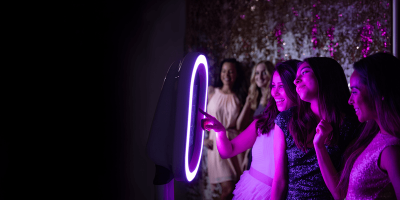 Guests enjoying M&M Classy Photo Booth at an elegant event